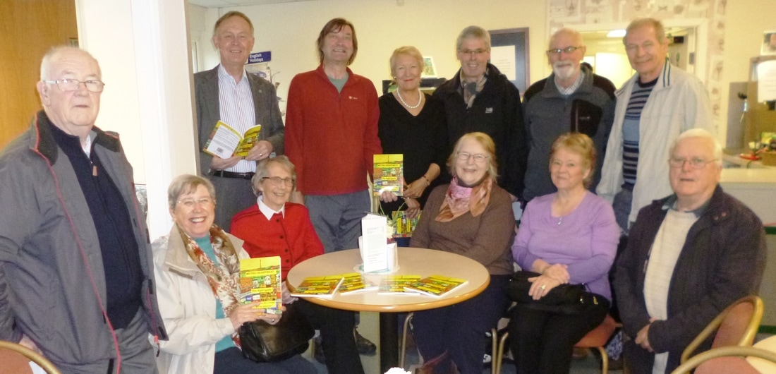 Photo taken from the website. Viv Longley is the lady sat in the middle with John Clarke standing just behind her